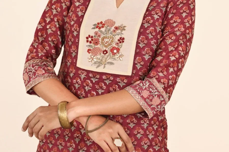 A woman wearing a long, tunic top