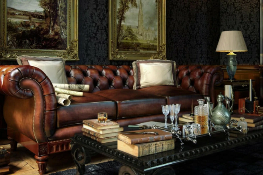 Sofa kulit coklat Chesterfield dengan bantal dan meja tengah