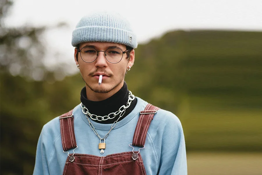 Man wearing a beanie and chain choker