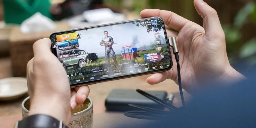 Person playing PUBG on gaming phone