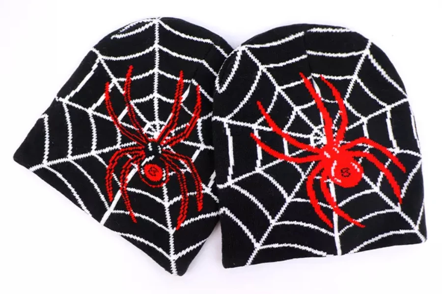 two-black-beanie-hats-with-spider-and-web-printed-on