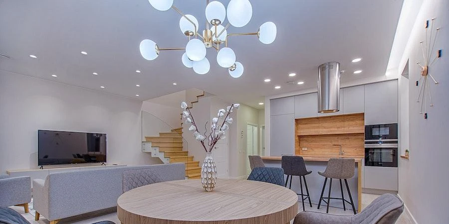 A living room with multiple indoor lighting fixtures
