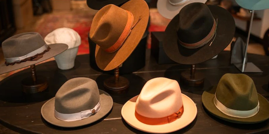 Different styles and colors of cowboy hats on display