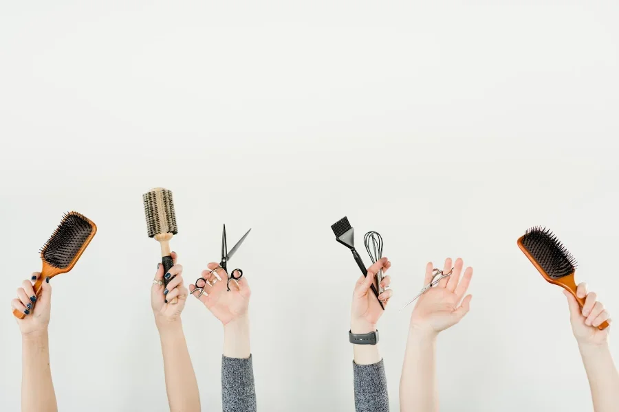 Hands in the air showing hairdressing supplies