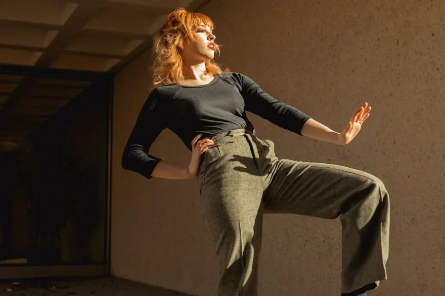 Lady striking a pose in ash straight-leg pants