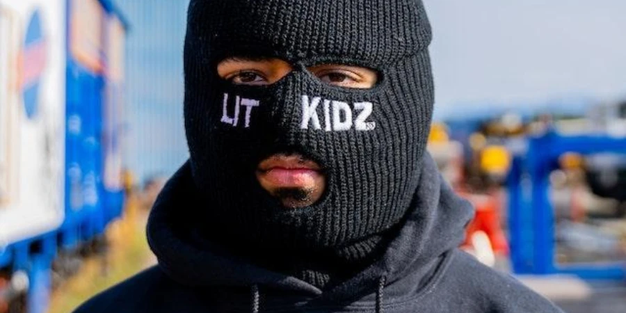 Man wearing a thickened ski mask outdoors