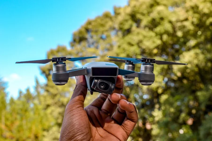 Person holding a quadcopter in their hand