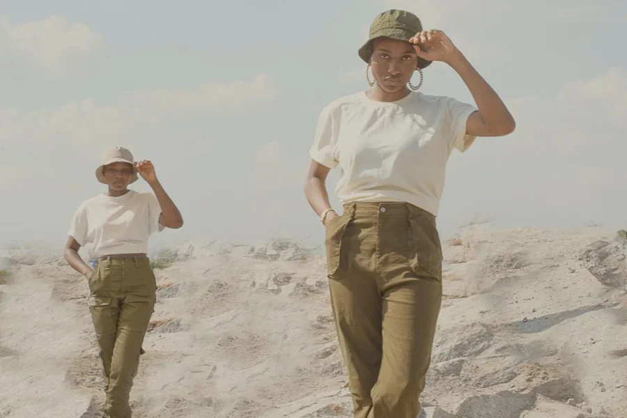 Women posing in a pair of brown utility-inspired pants