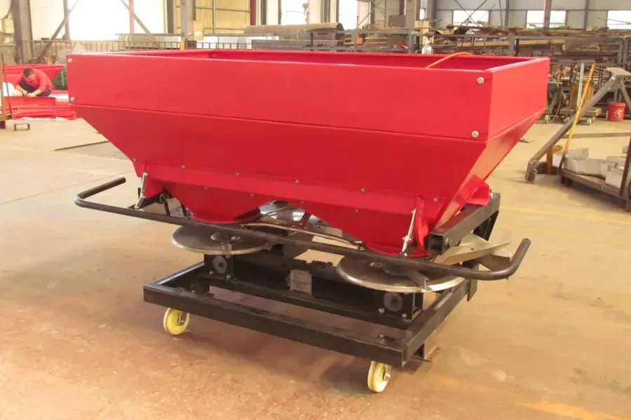A centrifugal fertilizer broadcaster in a factory