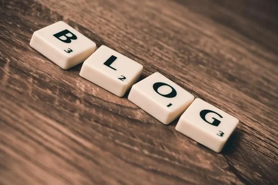 Blog spelled using Scrabble letters on wooden table