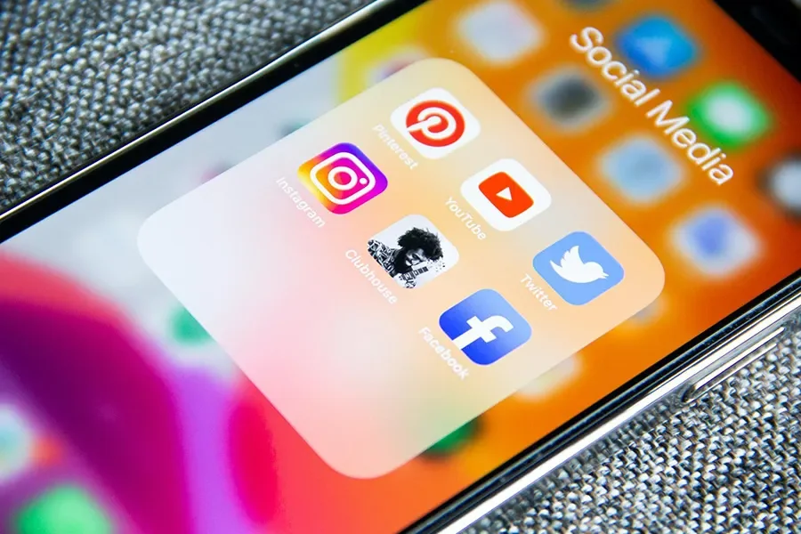 Smartphone with social media apps shown in a group
