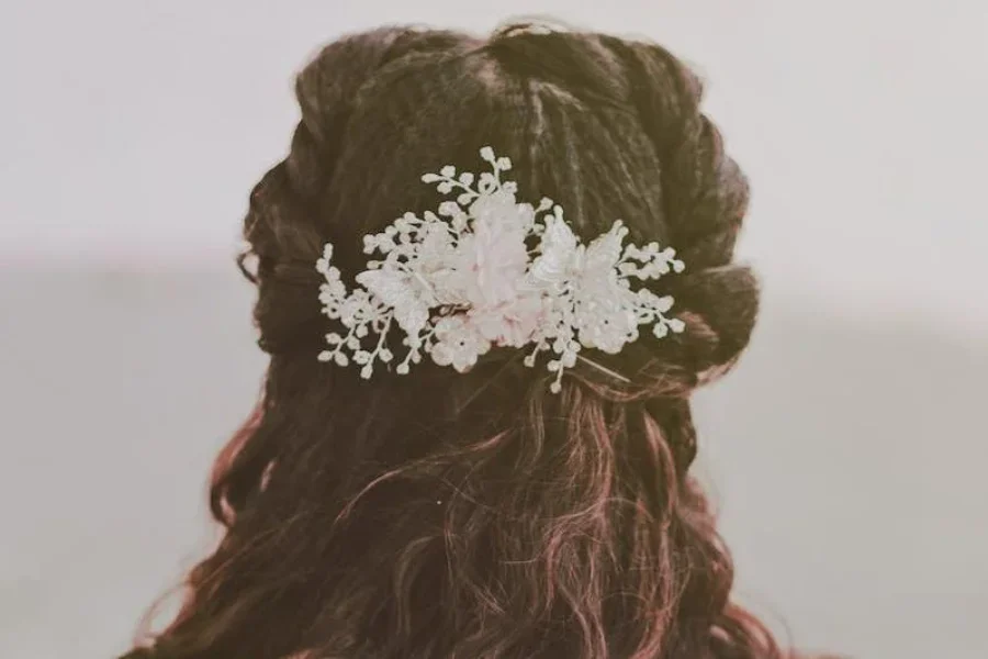 Woman wearing a white floral comb claw clip