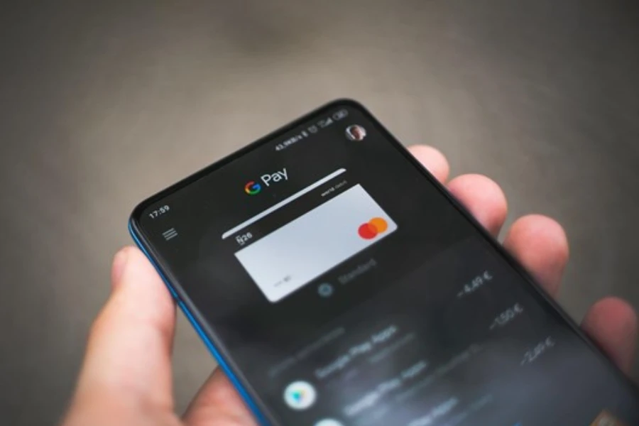 Black smartphone displaying an icon of Google Pay