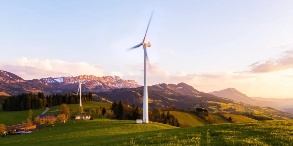 A landscape view of a spinning wind turbine
