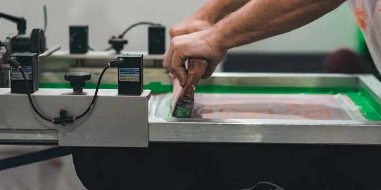 A person working on a printing machine