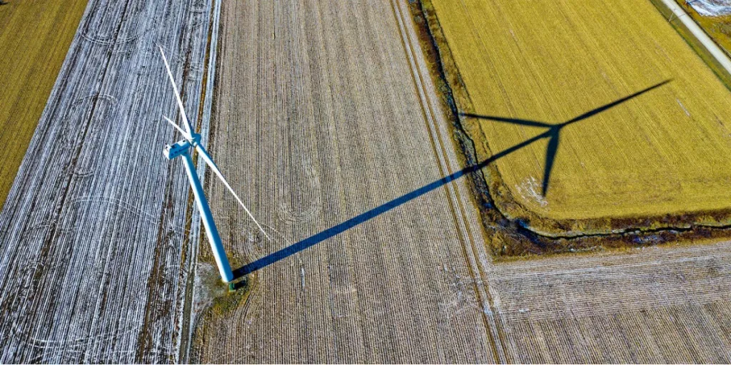 High angle photo of wind turbine on field