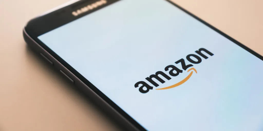 Smartphone with the Amazon logo on the screen