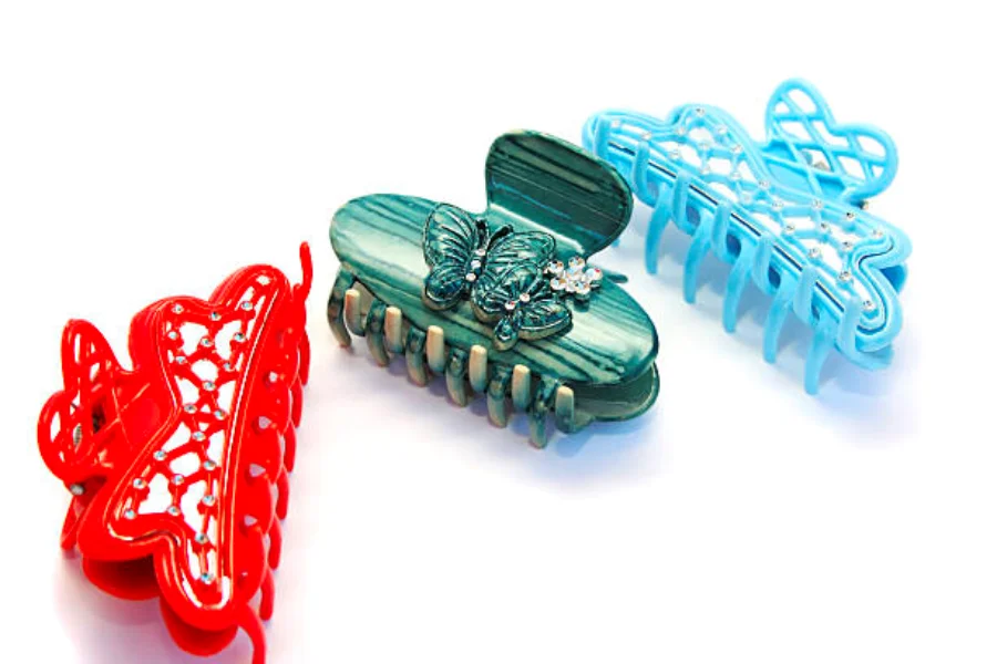 Three butterfly-shaped hair claws in multiple colors”