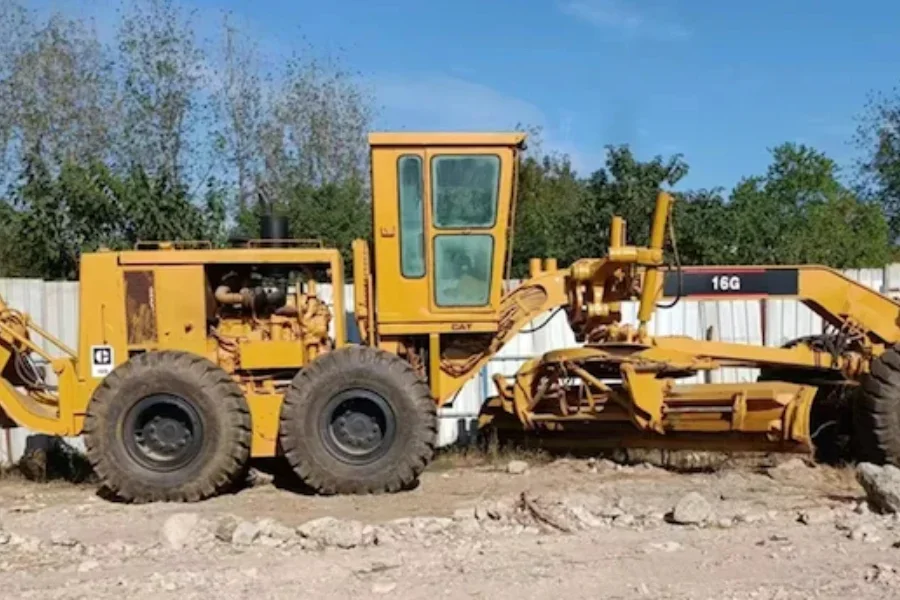 a Caterpillar Cat 16G motor grader at work
