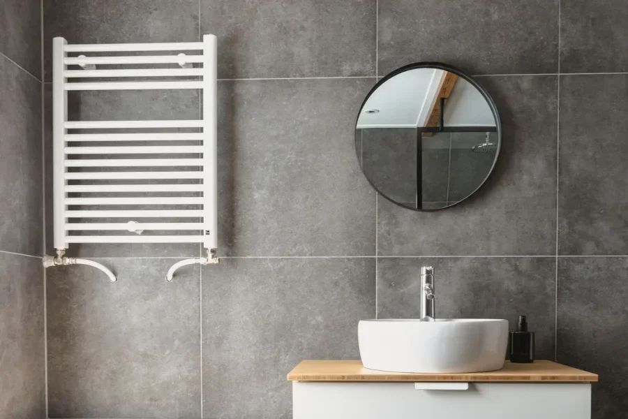 A hydronic wall-mounted towel warmer