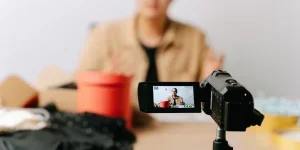 A man sitting in front of a video camera