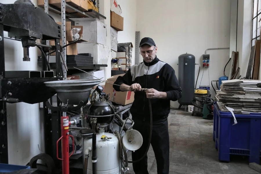 A person repairing a machine