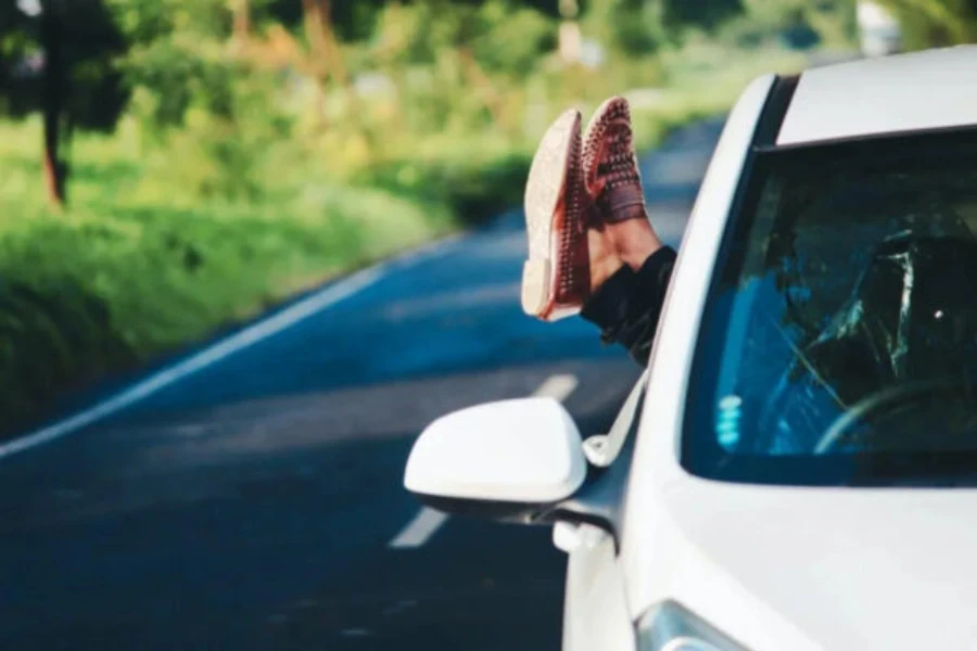 a person resting in a car