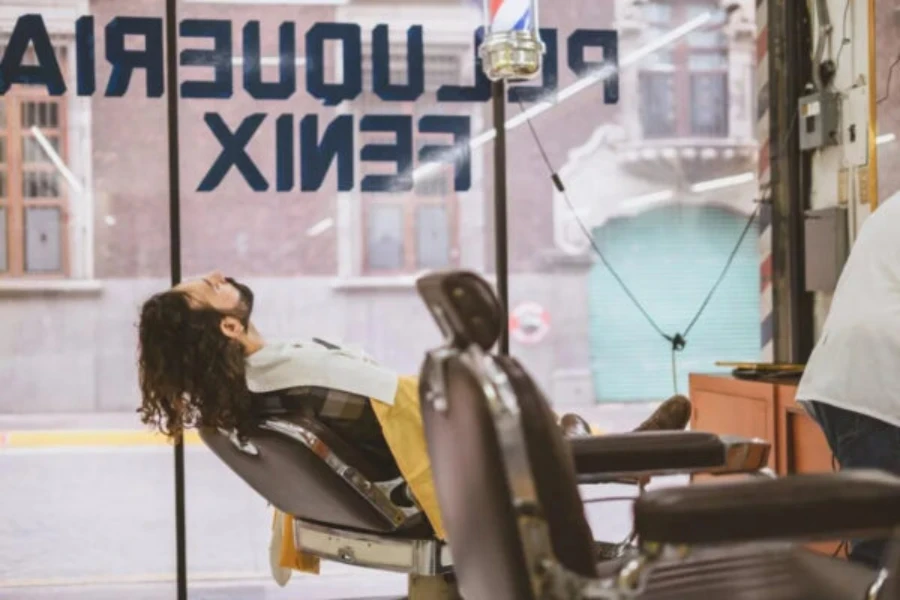 A reclining barber chair in a barbershop