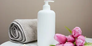 A white hair pump next to pink tulips