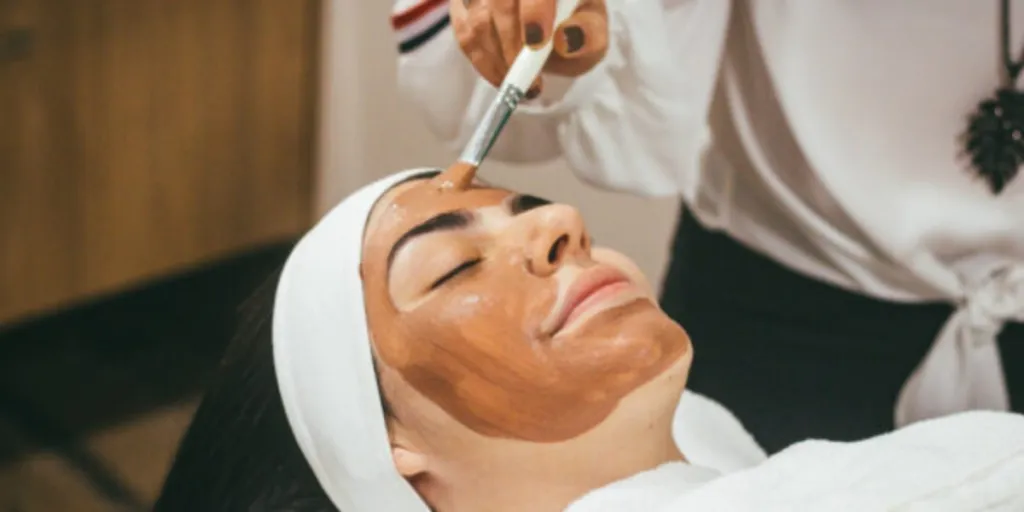 A woman getting a facial at a salon