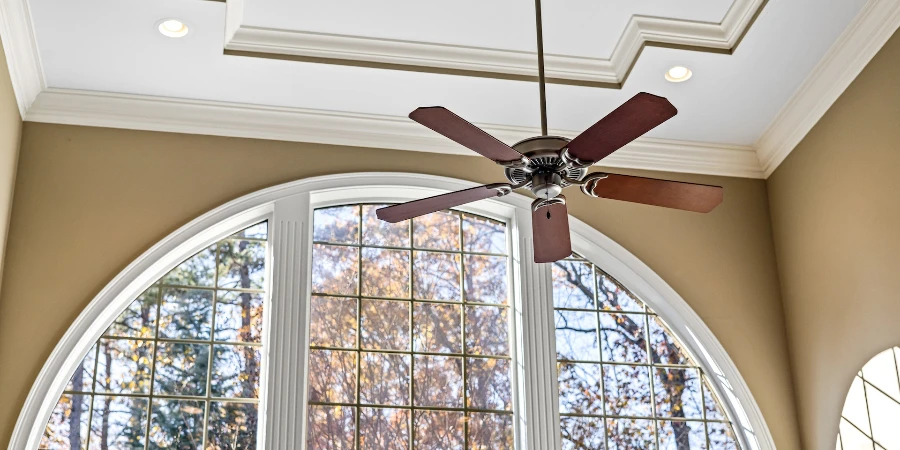 Brown ceiling fan on white ceiling