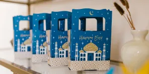 Eid al-Fitr boxes with crescents and mosque figures