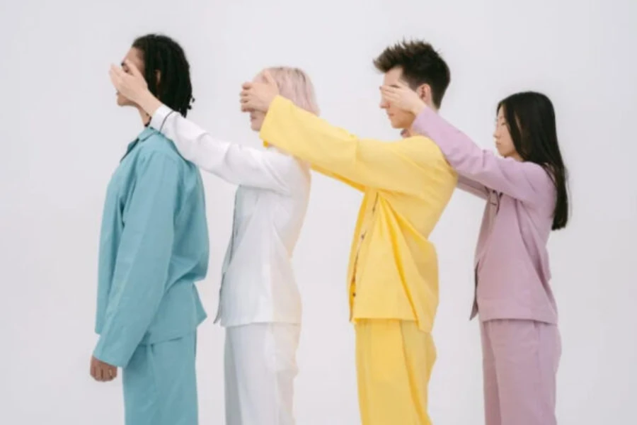 Four people wearing bamboo pajamas in bold colors