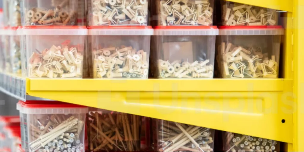 Metal nails in plastic containers on shelves