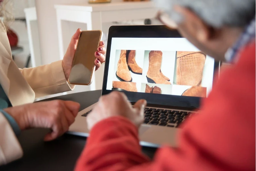 People examining pictures of products