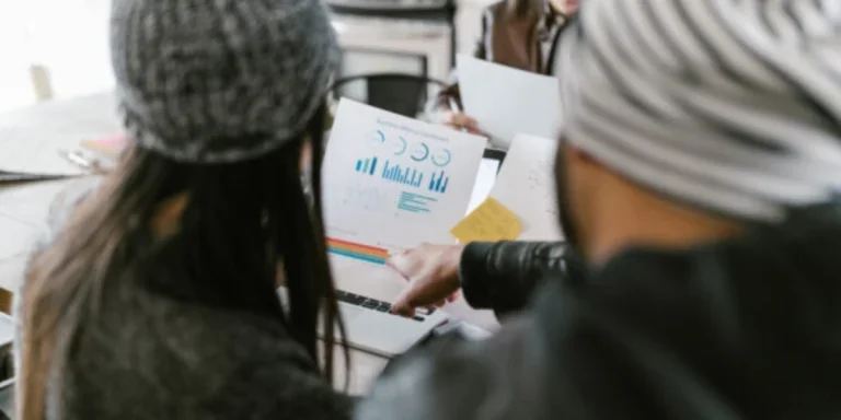 People looking at the ideas on white papers