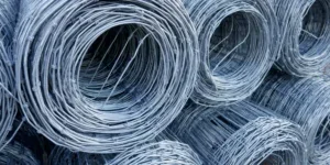 Rolls of wire mesh fencing stacked on top of each other