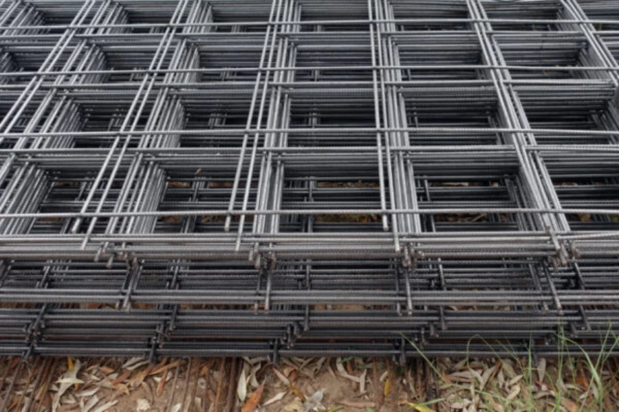 Sheets of concrete reinforcement mesh stacked in an industrial setting