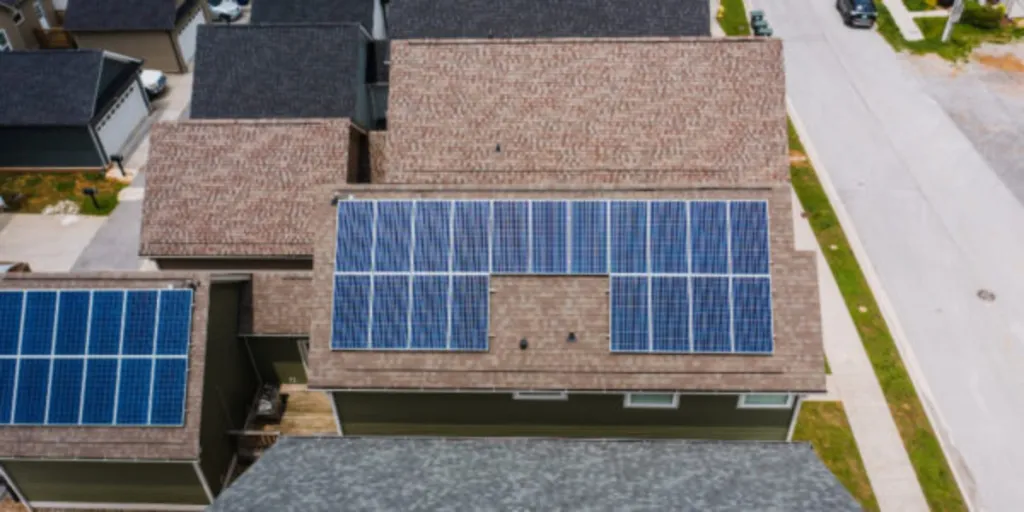 Solar panels on tiled roofs of a house