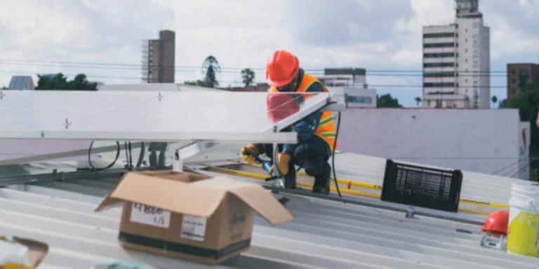 Solar technician installing solar panel