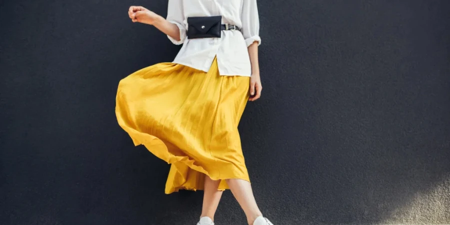 stylish slim woman in beautiful yellow skirt