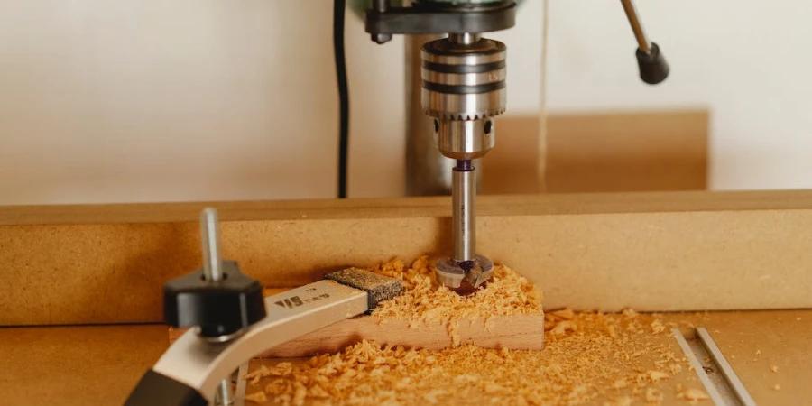 Drill press and clamp with timber in the workroom