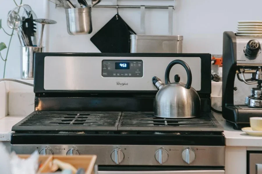 A black modern gas cooker with smart buttons