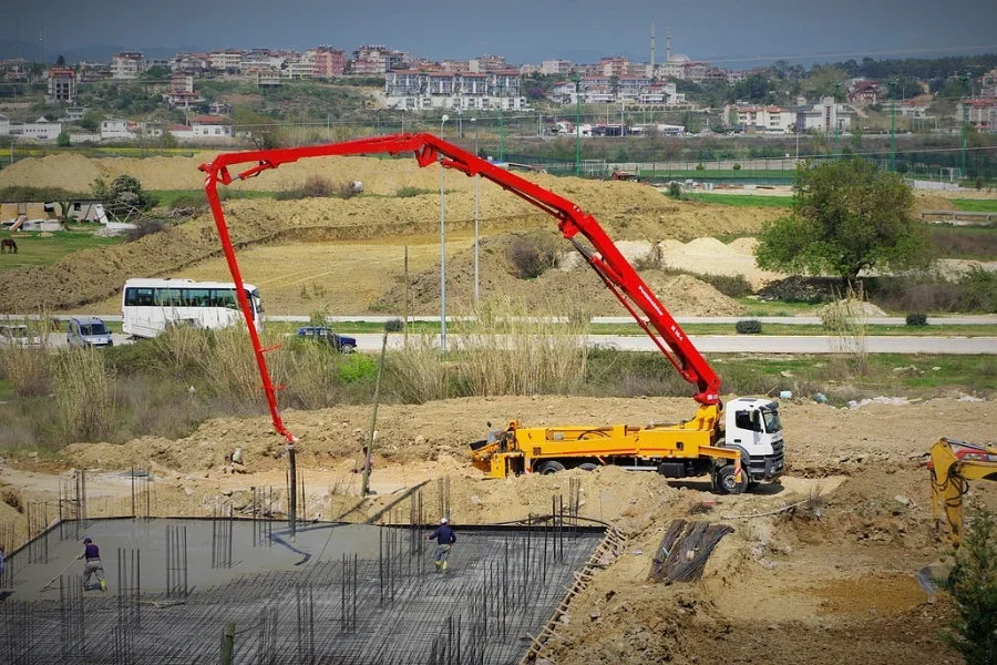 A crane truck in action at a construction site