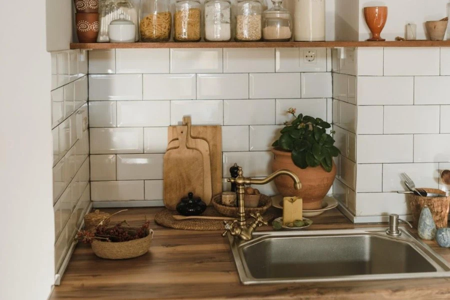 A standard kitchen with porcelain tile walls