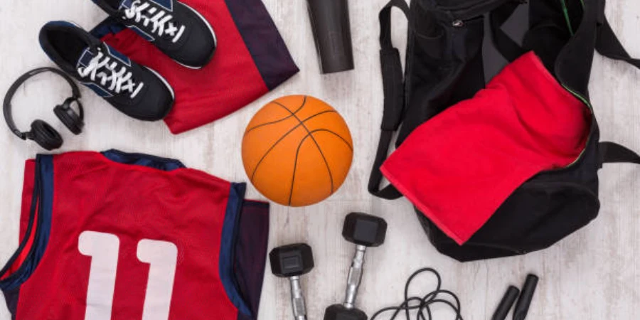 Basketball training equipment and clothing on the gym floor