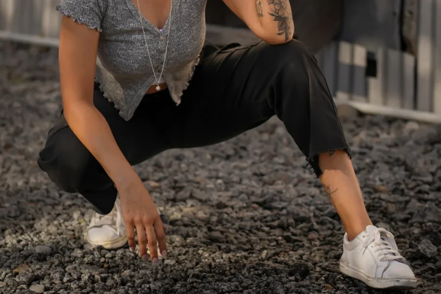 Black crop pants with distressed hems