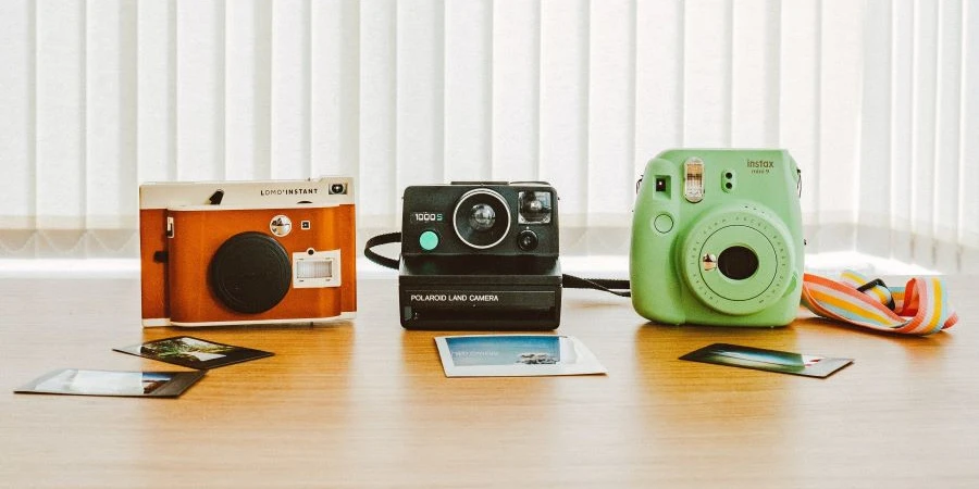Different types of instant cameras with sample photos