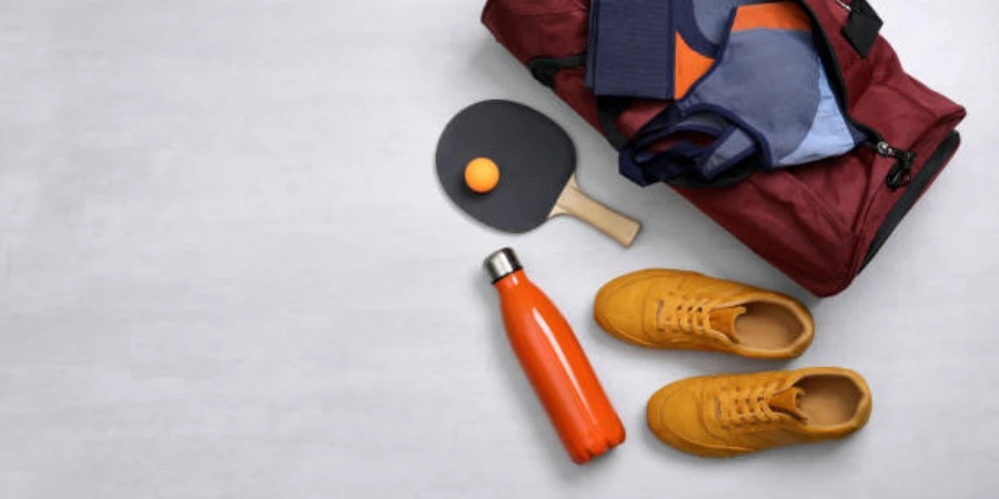 Gym bag with unisex table tennis shoes set outside it