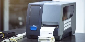 Label printer printing on a table